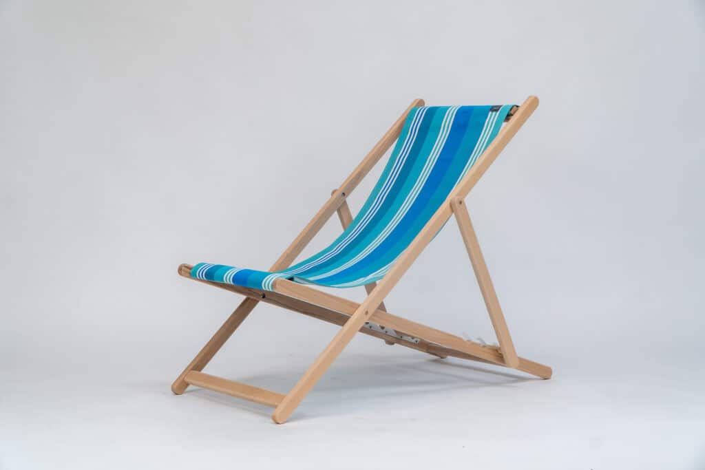 Beechwood Deckchair with Madrague fabric, turquoise, blue, green and white stripes, viewed from an angle - created by Decks and Stipes Ireland