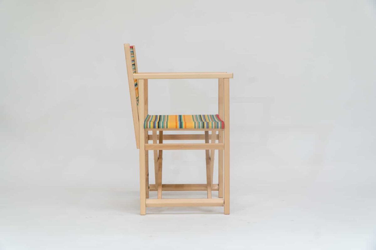 Beechwood Director's Chair with Medley fabric, red, orange, green, black, yellow and blue stripes, viewed from the side - created by Decks and Stipes Ireland