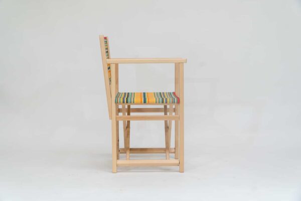 Beechwood Director's Chair with Medley fabric, red, orange, green, black, yellow and blue stripes, viewed from the side - created by Decks and Stipes Ireland