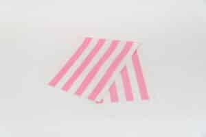 Discus Fabric, pink and ivory stripes by Decks and Stripes